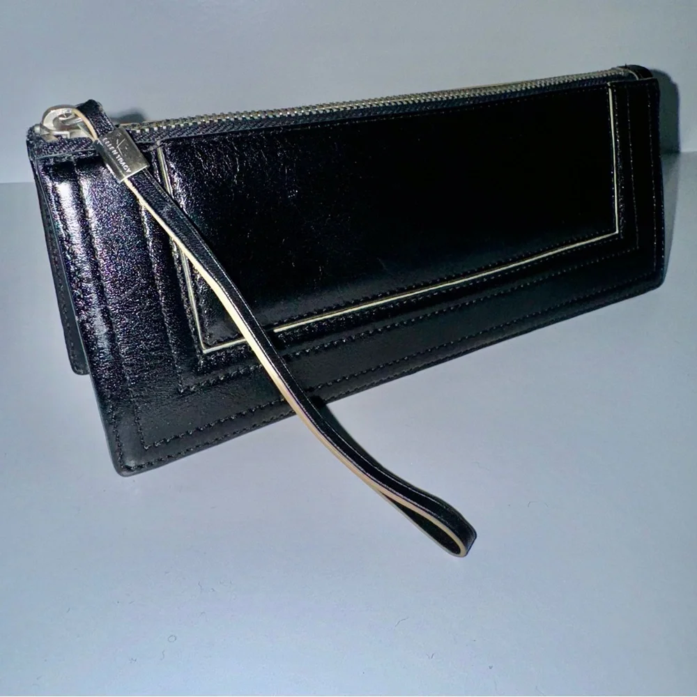 Ellen Tracy Black Leather Clutch with red logo interior.